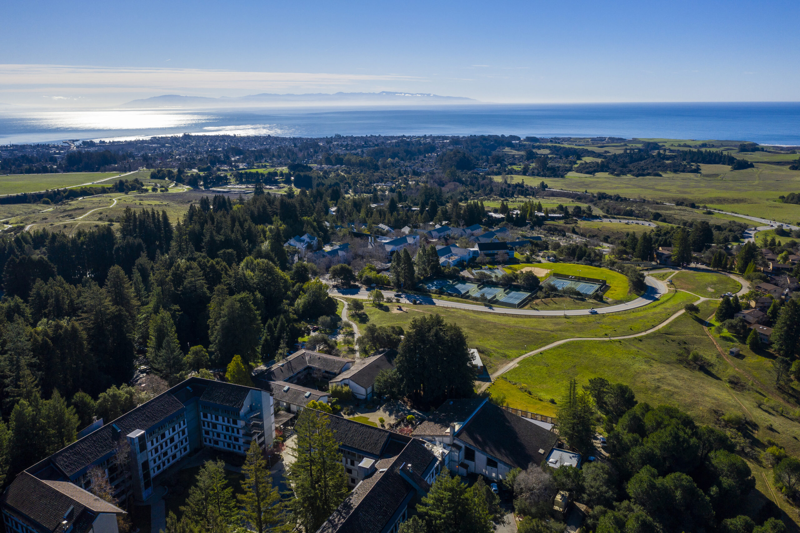 Aerial shot of campus with Monterey Bay in the background.