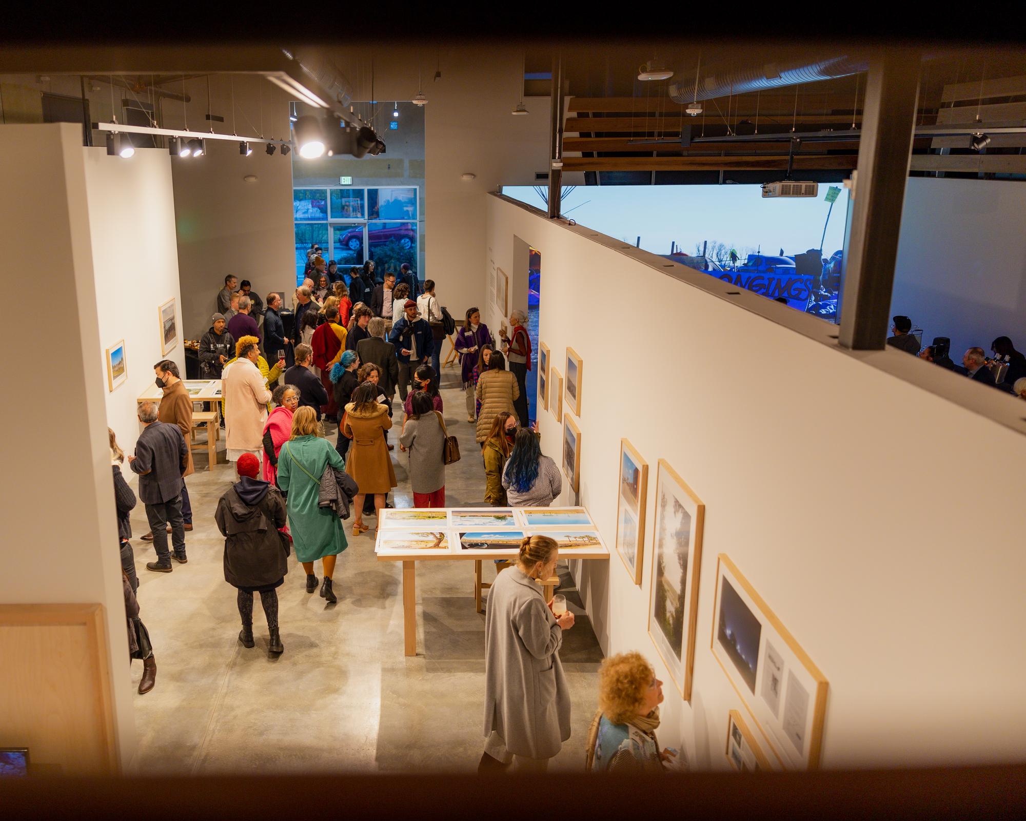 Crowd of people in an UCSC art gallery.