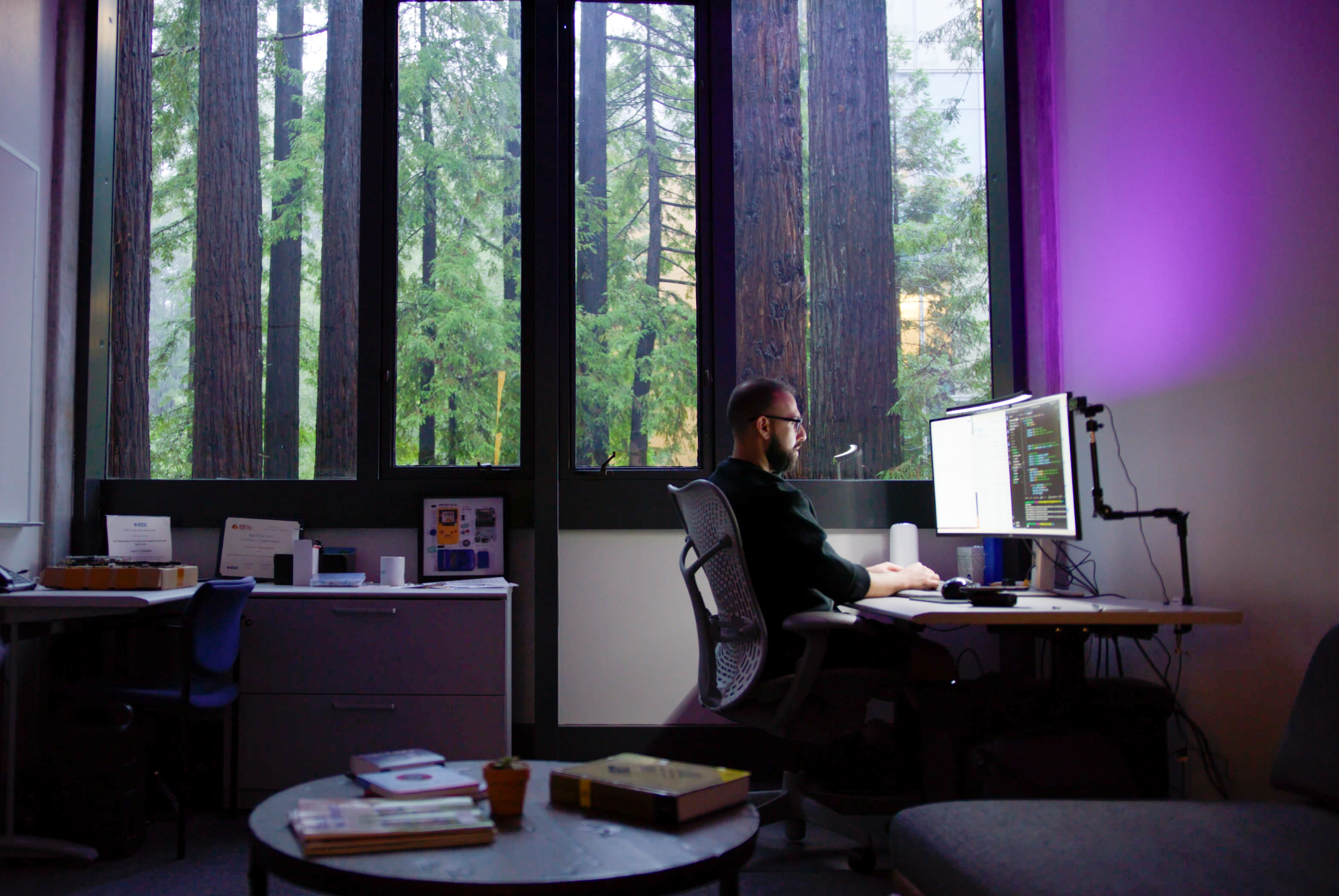 Assistant Professor of Electrical and Computer Engineering Jason Eshraghian works at his office computer on artificial intelligence development.