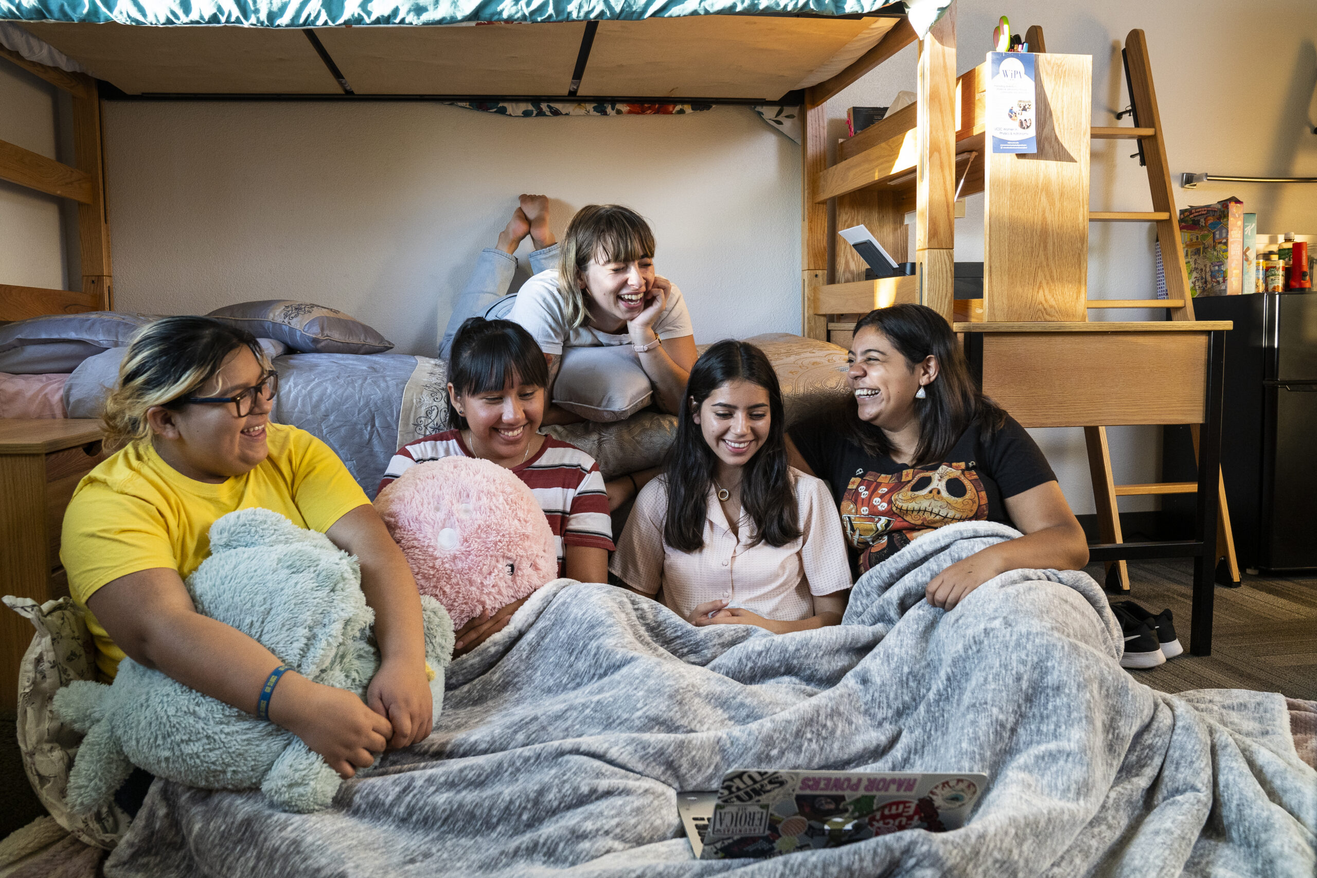 Friends gather inside a dorm room on the UC Santa Cruz campus. 